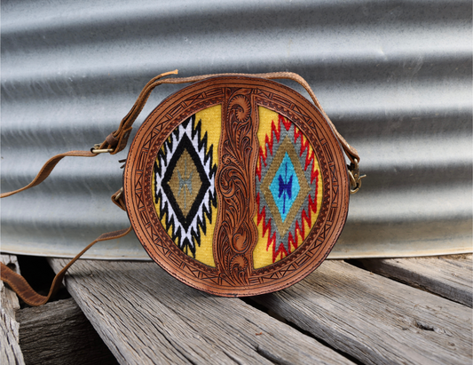 Round leather canteen bag with hand tooled front panel & coloured Aztec saddle blanket. 