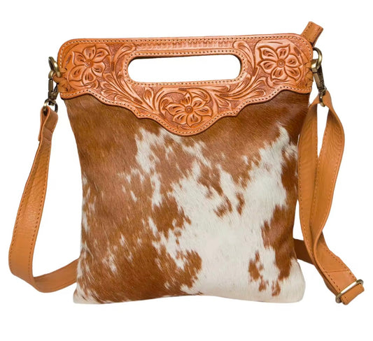 Stunning tan & white hair on hide crossbody bag with hand tooled leather.